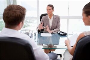 Female Lawyer Explaining Legal Situation to Her Clients Lawyer Discussing Case with Clients